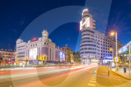 View of architecture and trail lights on Gran Via and Plaza del Calao at dusk, Madrid, Spain, Europe