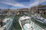 Boats and restaurants in Fishermans Wharf harbour, San Francisco, California, United States of America, North America