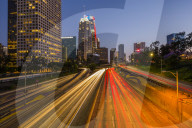 View of Downtown skyline and Harbour Freeway at dusk, Los Angeles, California, United States of America, North America