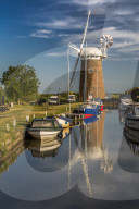 Boats and Horsey Mill reflecting in water, Norfolk Broads, Norfolk, England, United Kingdom, Europe