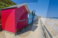 View of colourful beach huts on a summer day, Cromer, Norfolk, England, United Kingdom, Europe