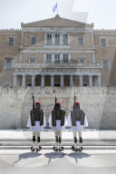Changing of the guard at the Tomb of the Unknown Soldier in Syntagma Square with the Old Royal Palace, Athens, Greece, Europe