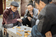Men playing traditional game of Xiangqi (Chinese Chess), Dali, Yunnan Province, China