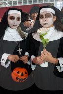 Young Japanese girls dressed as nunsat the Halloween celebrations in Shibuya, Tokyo