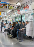Passengers on a Tokyo subway train.