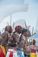 Portrait Samburu tribe members dancing the traditional wedding dance at dusk, Kenya.