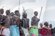 Portrait Samburu tribe members dancing the traditional wedding dance at dusk, Kenya.