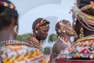 Portrait Samburu tribe members dancing the traditional wedding dance at dusk, Kenya.