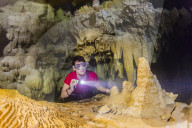 A snorkeler explores the fresh water grotto formations at Makatea, Tuamotus, French Polynesia.