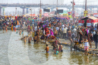 Pilgrims waiting to enter the Ganges river for the ritual bathing, Allahabad Kumbh Mela, Uttar Pradesh, India