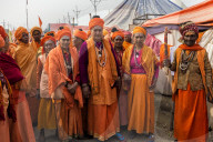 Sadhvi in orange red saree during Allahabad Kumbh Mela, World?s largest religious gathering, Uttar Pradesh, India