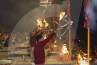 Priest celebrating the river Ganges Aarti by offering incense, Dashashwamedh Ghat, Varanasi, Uttar Pradesh, India