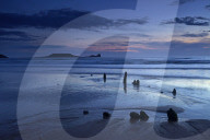 Dusk over the wreck of the Helvetia and Worms Head at Rhossili Bay, Gower, Wales, United Kingdom, Europe.