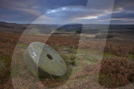 Abandoned millstone below Stanage Edge, Peak District National Park, Derbyshire, England, U.K.