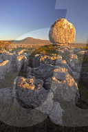 Ingleborough seen from a limestone boulder on Twistleton Scar, Yorkshire Dales National Park, North Yorkshire, England, U.K.