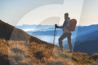Mountain trekker in Autumn Season in Stelvio National park in Brescia province, Lombardy district, Italy, Europe.