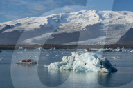 A boat tour on Jokulsarlon Glacier Lagoon, with Breidamerkurjokull Glacier ehind, South East Iceland, Iceland