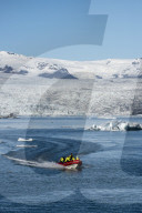 Boat tour on Jokulsarlon Glacier Lagoon, with Breidamerkurjokull Glacierbehind, South East Iceland, Iceland