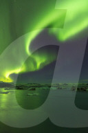 The Aurora Borealis display over Jokulsarlon Glacial Lagoon, South Iceland.