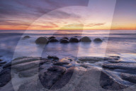 The Moeraki Boulders with incredible sunrise, Moeraki Beach, Otago, New Zealand.