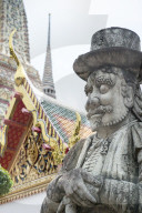 Close up of stone statue of guard in Wat Pho, Bangkok, Thailand.