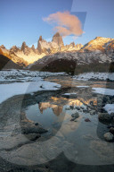 Fitz Roy at sunrise reflected in flowing river, Los Glaciares National Park, El ChaltÃ©n, Santa Cruz Province, Patagonia,
