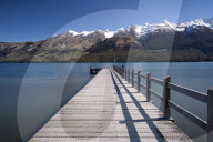 Wooden Jetty leading into turquoise Lake Wakitipu, Queenstown, New Zealand