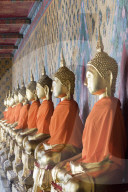 Seated Buddha statues in a row at Wat Pho (Temple of the Reclining Buddha), Bangkok, Thailand
