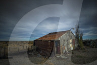 Old shed set against open landscape in Patagonia, Argentina, South America.