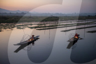 Two Intha leg rowing fisherman at Inle Lake gardens, Inle Lake, Shan State, Myanmar.