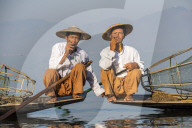 Two Intha leg rowing fishermen smoking cigars, Inle Lake, Shan State, Myanmar