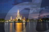 Wat Arun Temple reflected at twilight in Bangkok Thailand