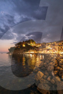 Sunset at Parga Castle and harbour, Parga, Preveza, Greece.