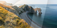 View from clifftop to Durdle Door, Jurassic Coast World Heritage Site, West Lulworth, Dorset, England.