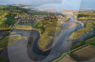 Aerial view of the meandering estuary of the River Aln, Alnmouth, Northumberland, England.