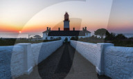 Sunrise behind Souter Lighthouse, Marsden, South Shields, Tyne and Wear, England.