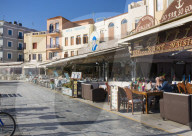 Colourful waterfront cafes and hotels beside the Venetian Harbour, Hania, aka Chania, Crete, Greece