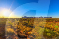 Sunrays at afternoon of Kata Tjuta in Uluru-Kata Tjuta National park at sunset. Australian outback from platform dune viewing area at twilight in Northern Territory, Australia.