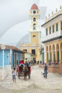 Street scene featuring San Francisco de Asis in Trinidad, Cuba