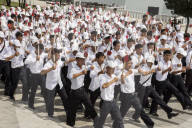 Kim Il Sung Square, hordes of young people rehearsing marching routines prior to a grand parade, Pyongyang, North Korea