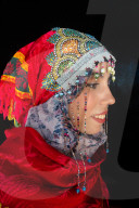 Close-up side portrait of beautiful young Moroccan woman in traditional Berber dress, in Chefchaouen, Morocco (Model Release)