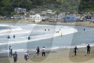 Surfers and walkers, Lyall Bay, Wellington, New Zealand