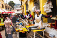 Women fishmongers selling at their shop-fronts near San Pedro Market, Cusco, UNESCO World Heritage Site, Sacred Valley, Peru