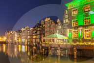 The Grasshopper steakhouse on Oudebrugsteeg Damrak canal with typical dutch houses central Amsterdam Holland Netherlands EU