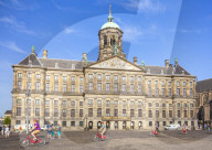 Amsterdam Royal palace, Koninklijk Paleis in Dam square with cyclists ,central Amsterdam Netherlands, Holland, EU, Europe