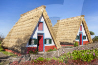 Traditional triangular thatched A-framed Palheiro Houses Santana Madeira Portugal