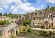Castle Combe Water lane with bridge over By brook on to The Street Castle Combe village Castle Combe Cotswolds Wiltshire england