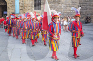 Participants in Calcio Storico Fiorentino festival marching through Piazza della Signoria, Florence, Tuscany, Italy, Europe