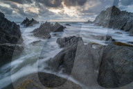 Stormy sunset over the dramatic North Devon coast, Devon, England. Summer (August) 2018.