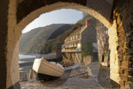 Clovelly harbour through archway, Devon, England. Spring (April) 2019.